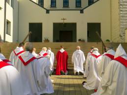 The community processes into the abbey church on Palm Sunday